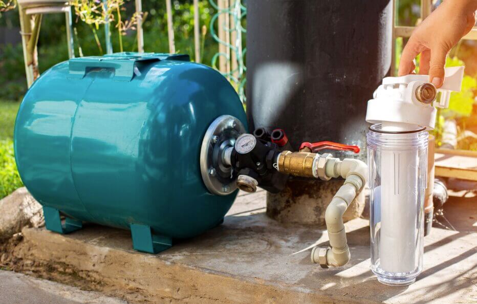 Well water treatment system, filter, and well tank