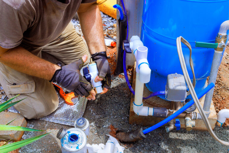 Providing connection service for water well to house water system by plumber